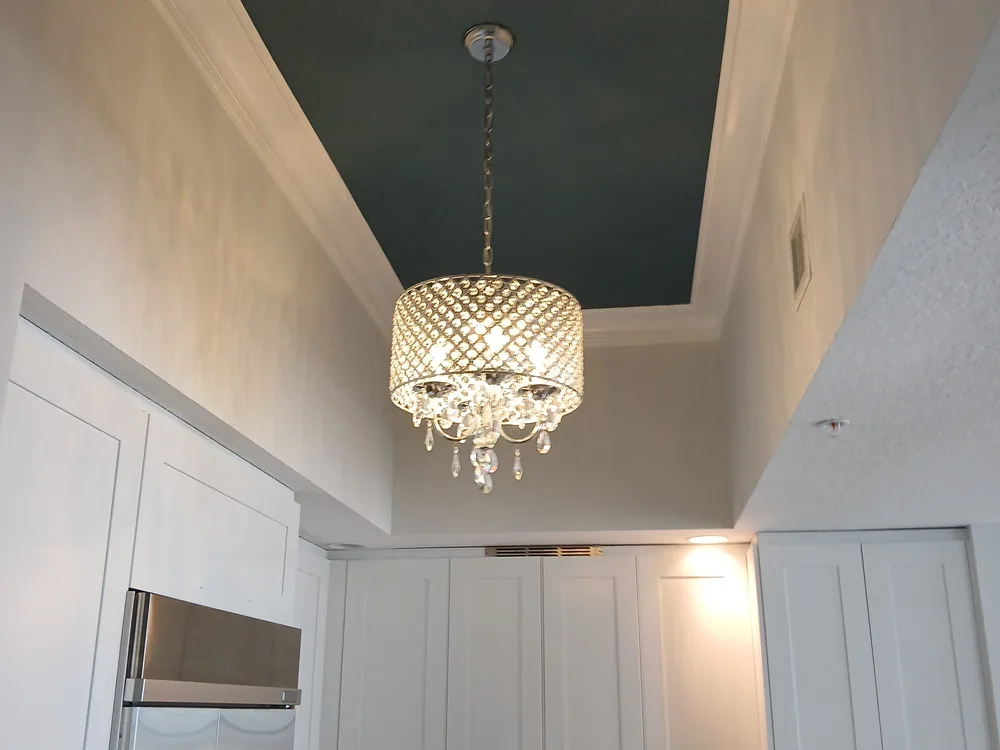 Vaulted kitchen with refinished white cabinets