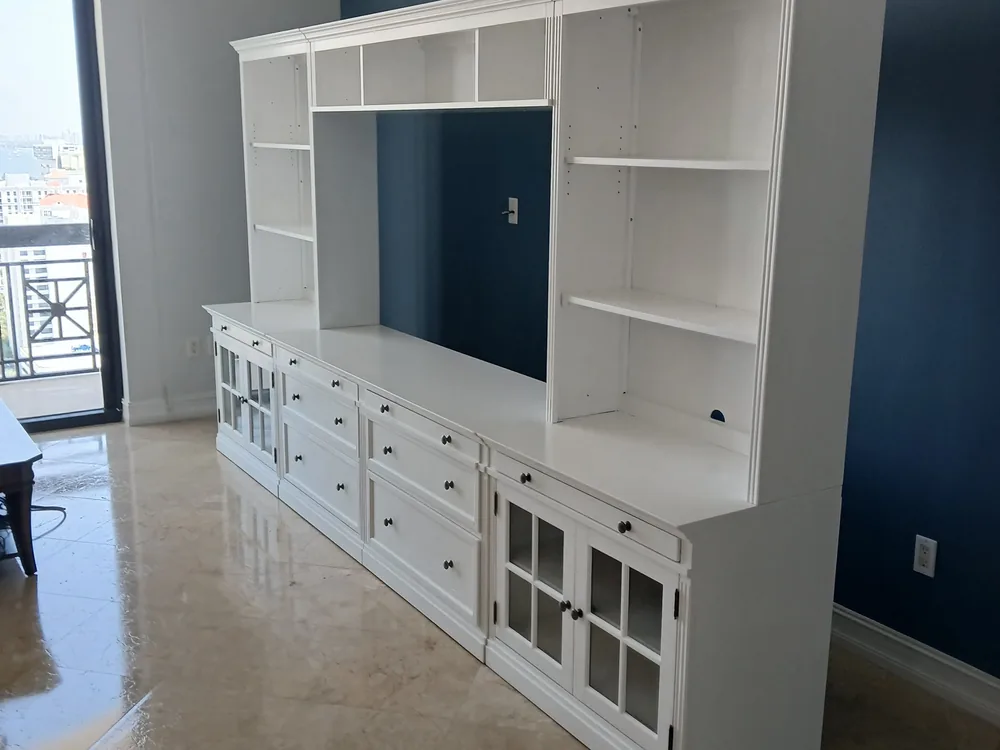 Custom white built-in shelving, painted and finished