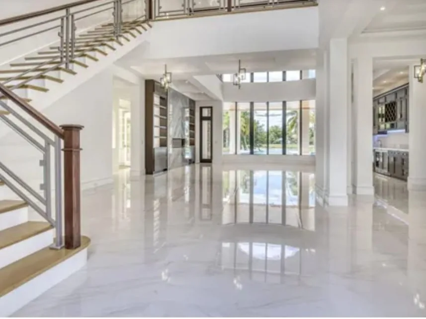 Luxury home interior with marble floors and a grand staircase, finished by Perry Painting